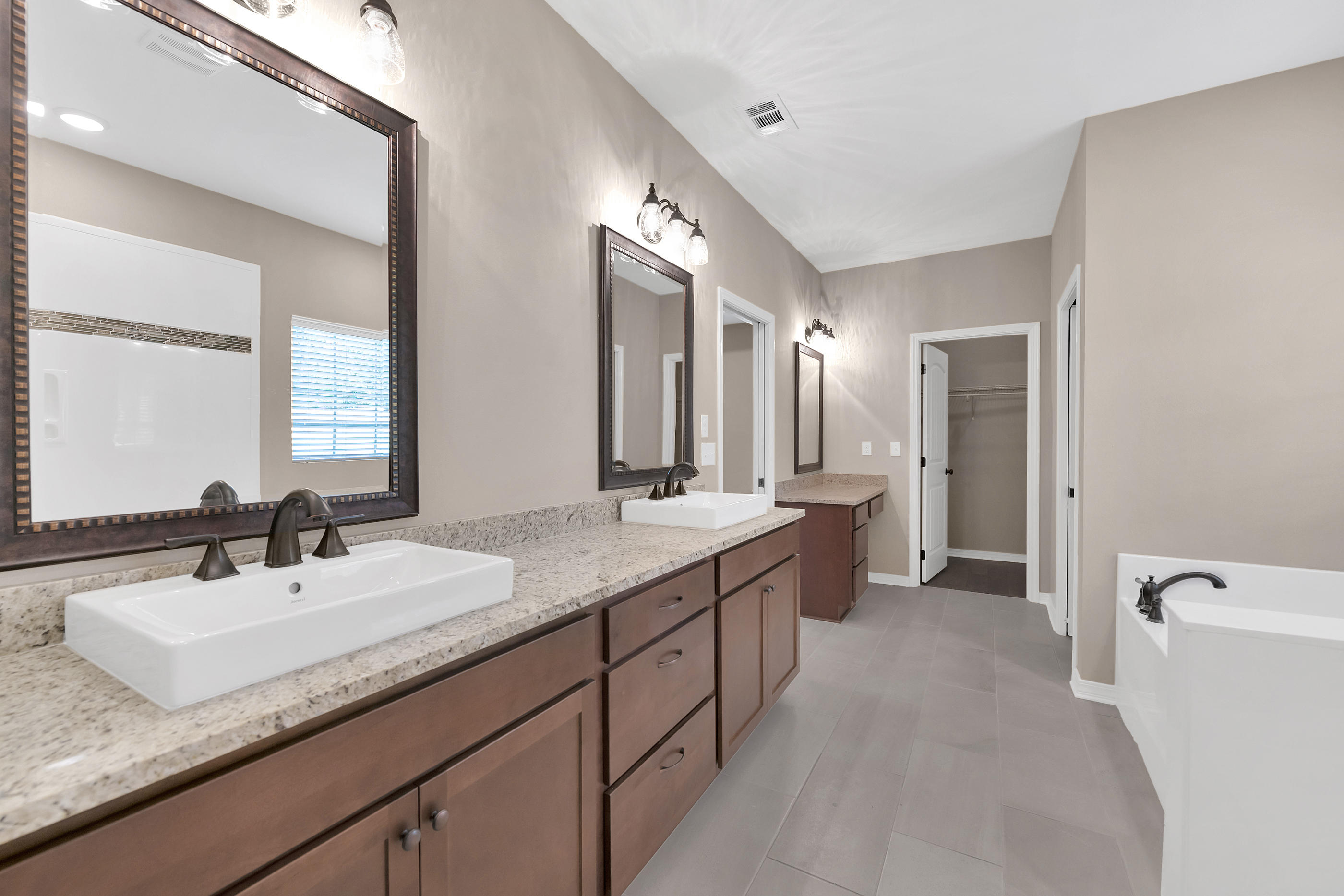 6195 Timberland Ridge Drive Crestview, FL 32539 - Photo 28 of 39 a bathroom with a granite countertop sink double and mirror