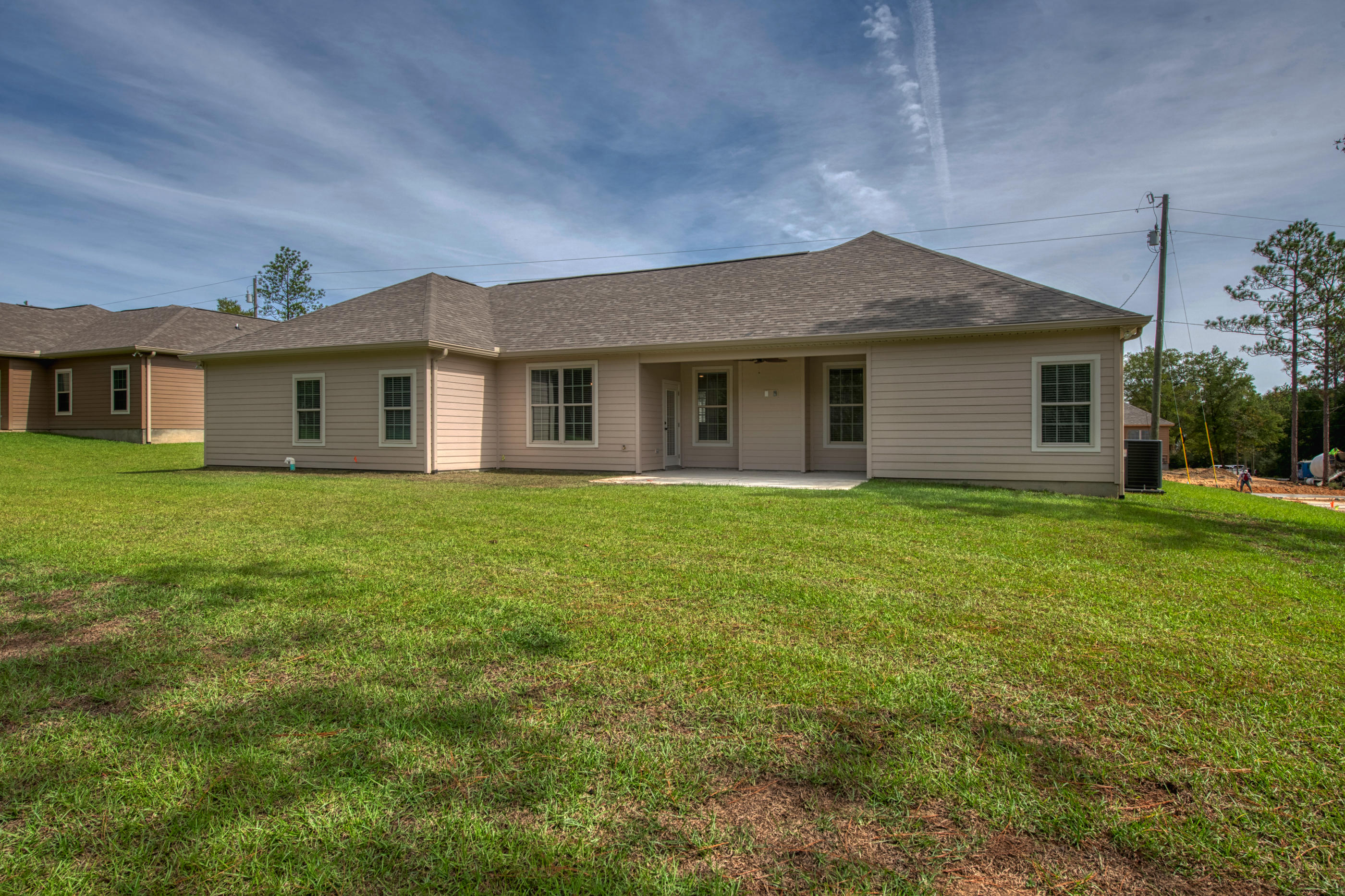 6195 Timberland Ridge Drive Crestview, FL 32539 - Photo 33 of 39 a front view of house with yard and green space