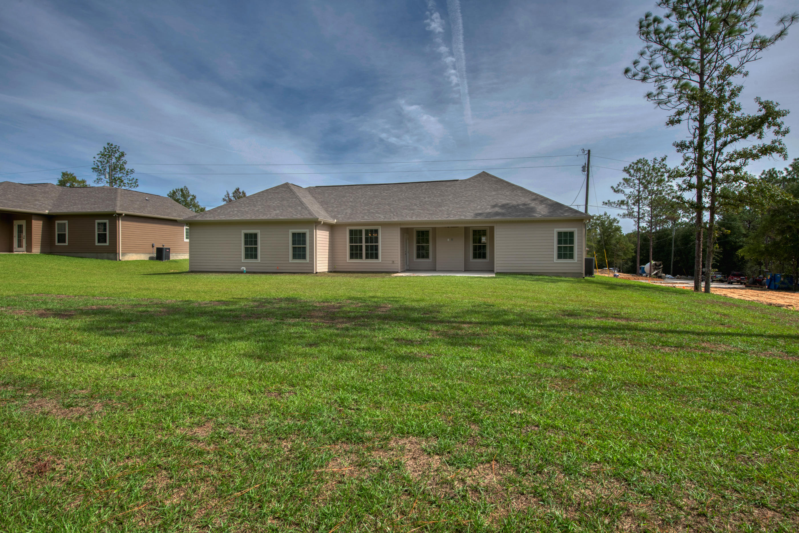 6195 Timberland Ridge Drive Crestview, FL 32539 - Photo 34 of 39 a front view of a house with a garden