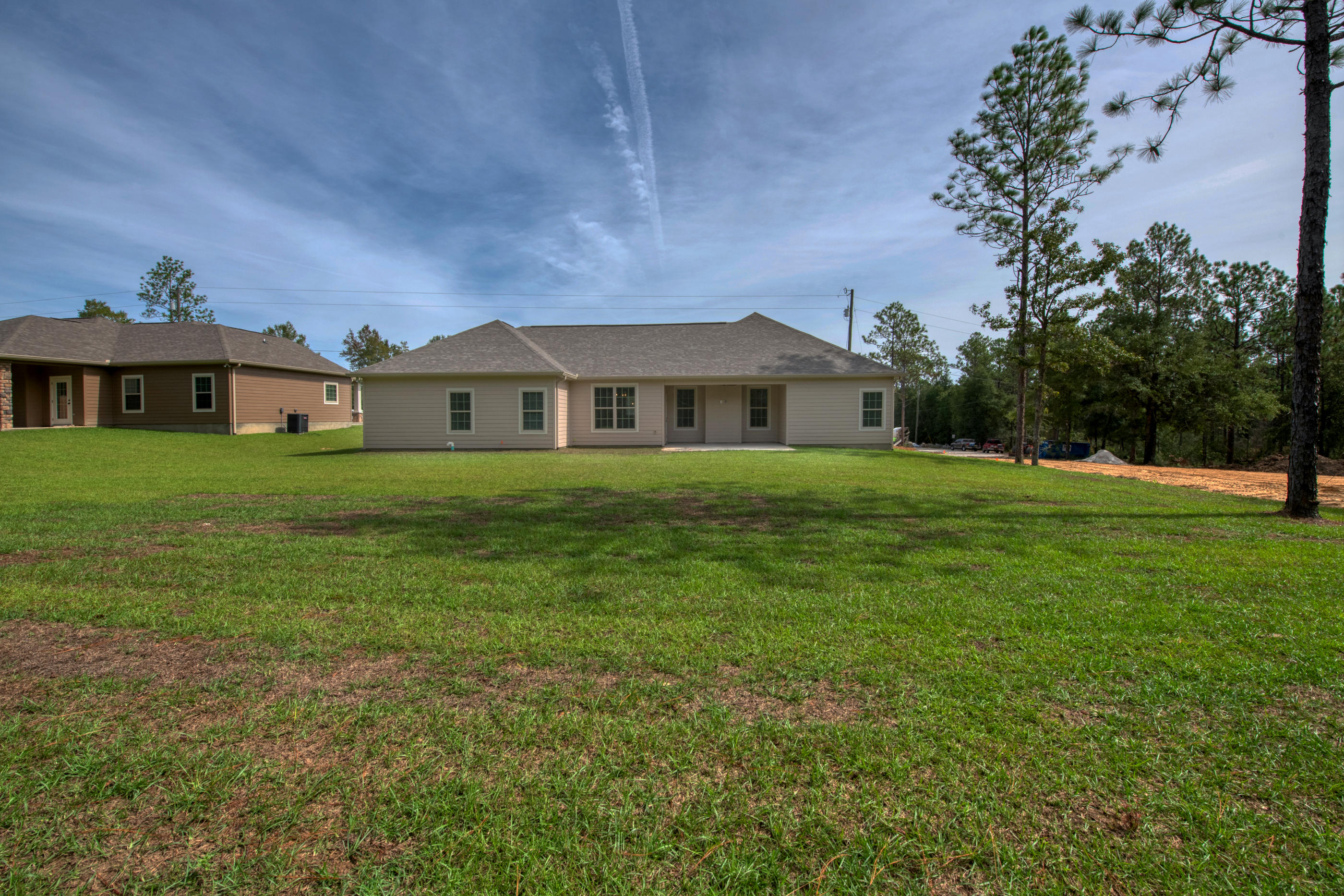 6195 Timberland Ridge Drive Crestview, FL 32539 - Photo 35 of 39 a front view of a house with a yard
