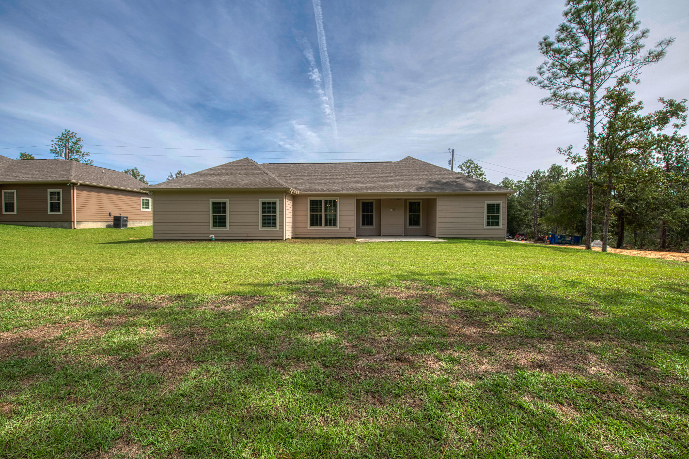 6195 Timberland Ridge Drive Crestview, FL 32539 - Photo 36 of 39 a view of a house with a big yard and large trees