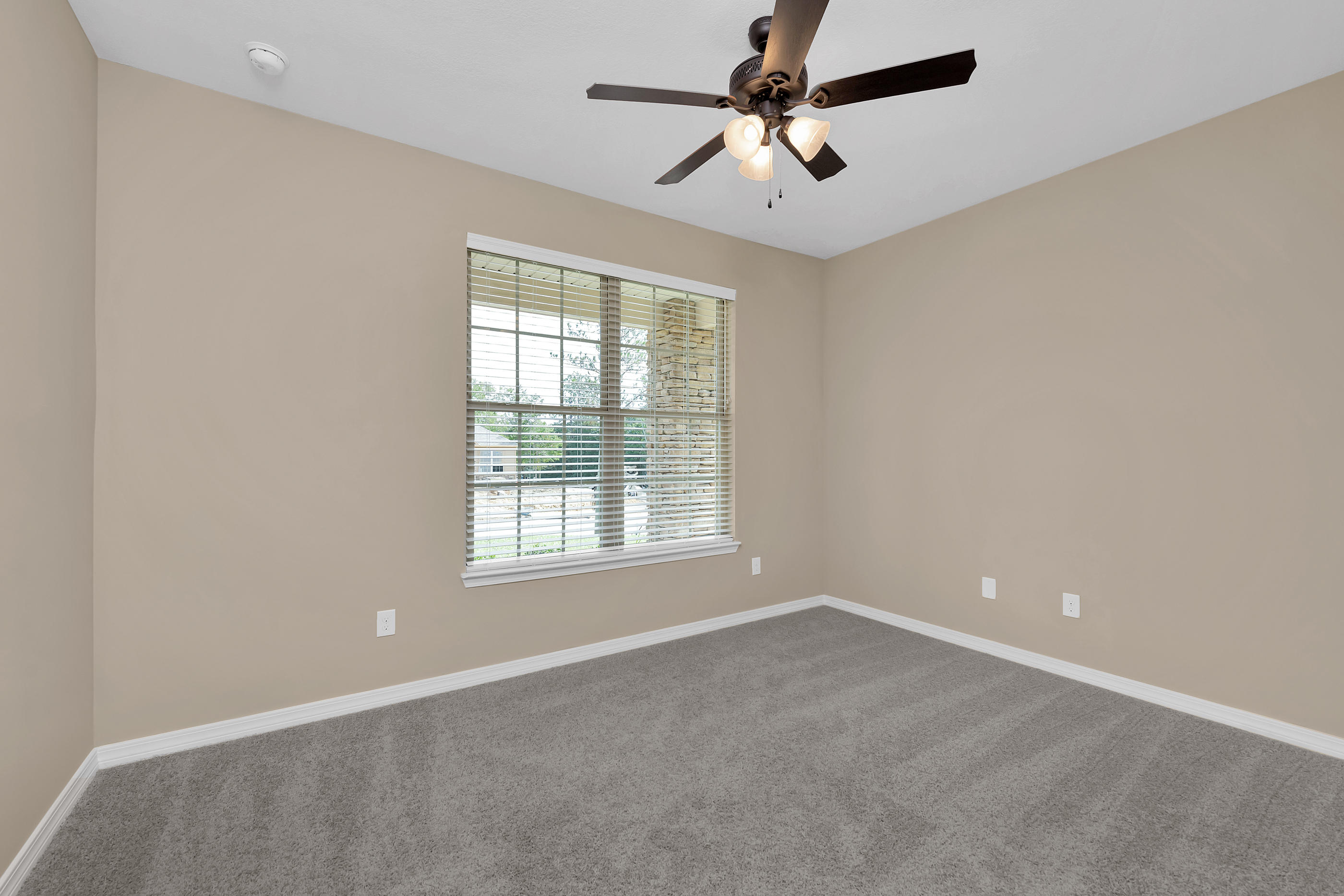 6195 Timberland Ridge Drive Crestview, FL 32539 - Photo 6 of 39 an empty room with a window and a fan