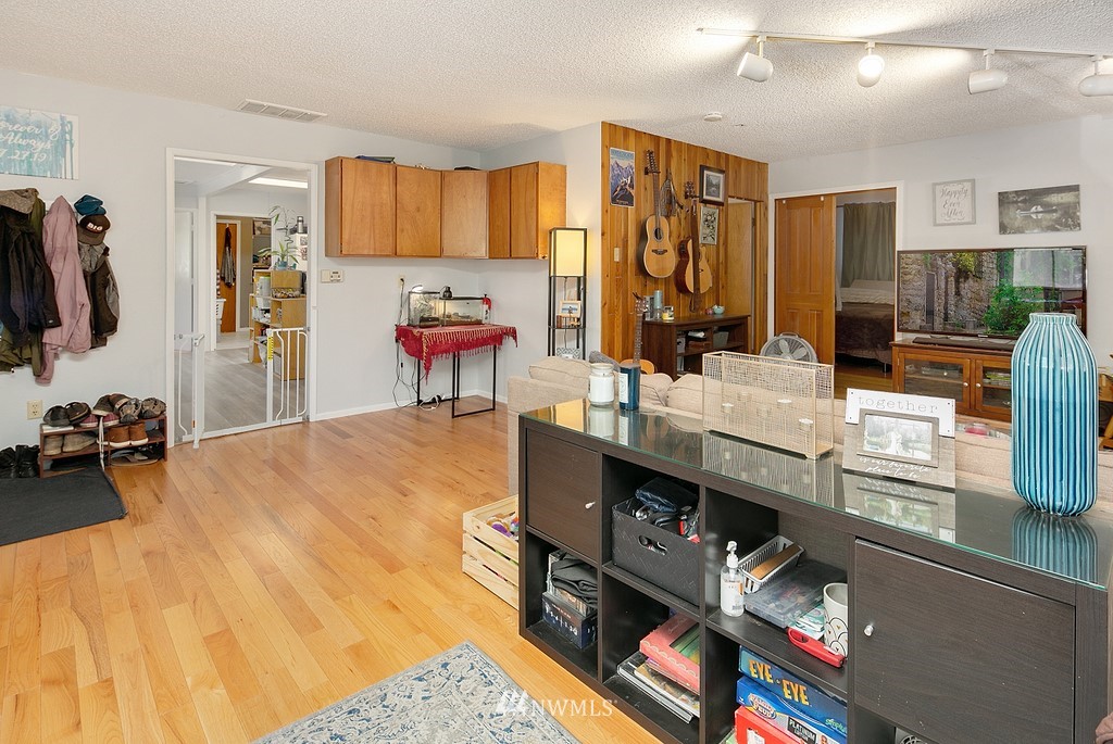 12008 Gibson Road Everett, WA 98204 - Photo 2 of 32 a living room with furniture and a flat screen tv