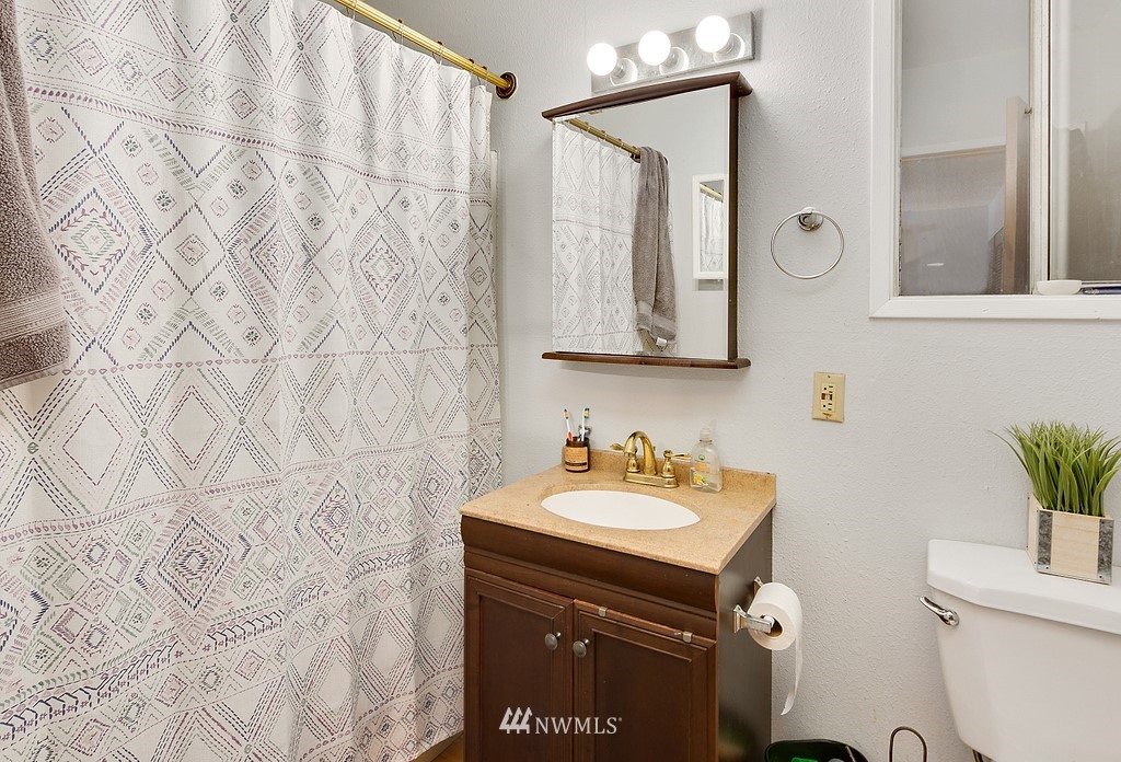 12008 Gibson Road Everett, WA 98204 - Photo 14 of 32 a bathroom with a sink and a mirror