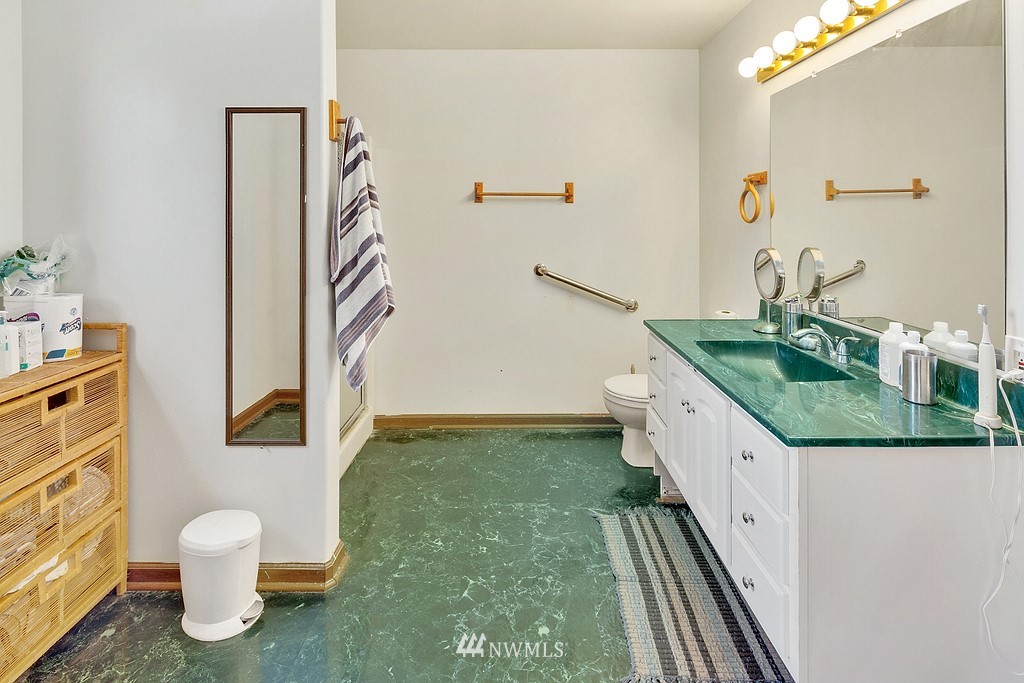 12008 Gibson Road Everett, WA 98204 - Photo 21 of 32 a bathroom with a sink and a mirror