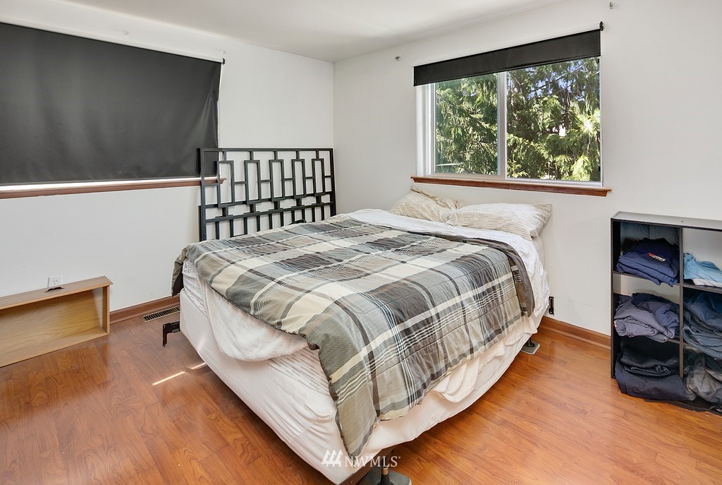 12008 Gibson Road Everett, WA 98204 - Photo 22 of 32 a bed sitting in a bedroom next to a window
