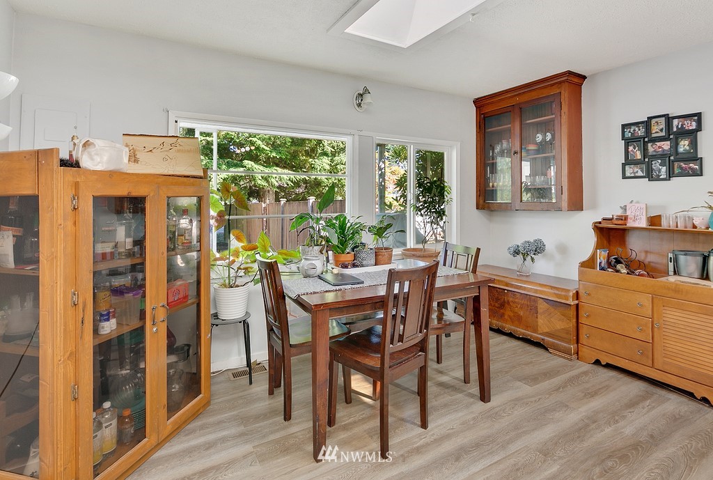 12008 Gibson Road Everett, WA 98204 - Photo 6 of 32 a view of a dining room with furniture window and wooden floor