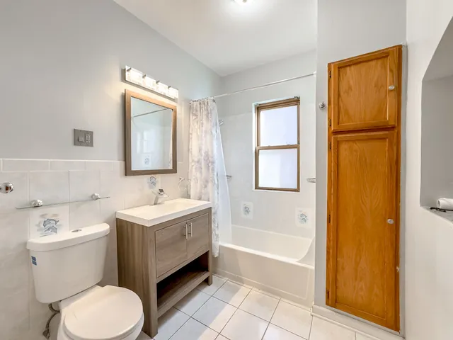 a bathroom with a sink toilet and bathtub