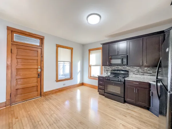 a kitchen with stainless steel appliances granite countertop a stove and a sink