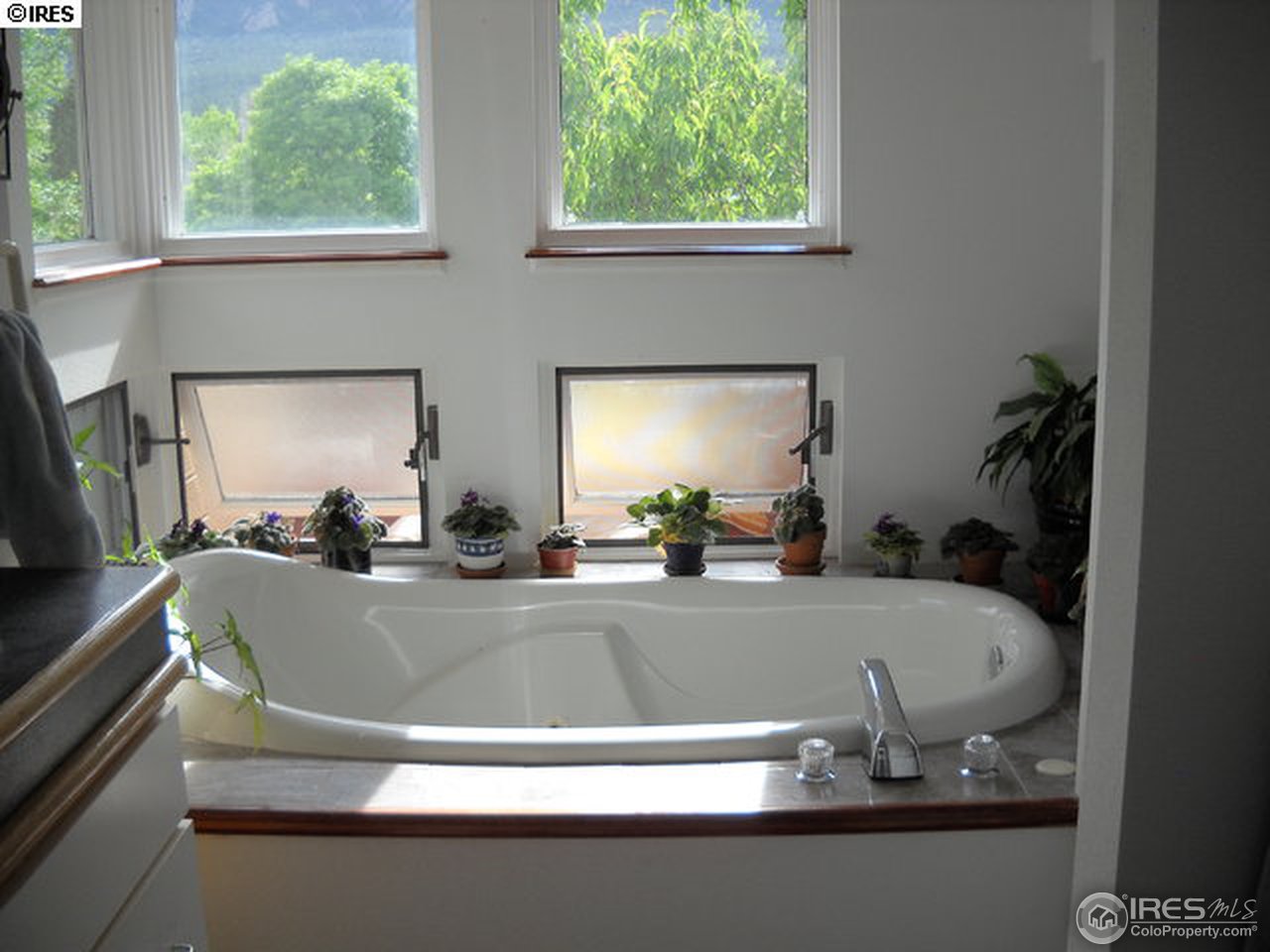3172 Redstone Road Boulder, CO 80305 - Photo 12 of 24 a view of a sink a table and chair in a living room