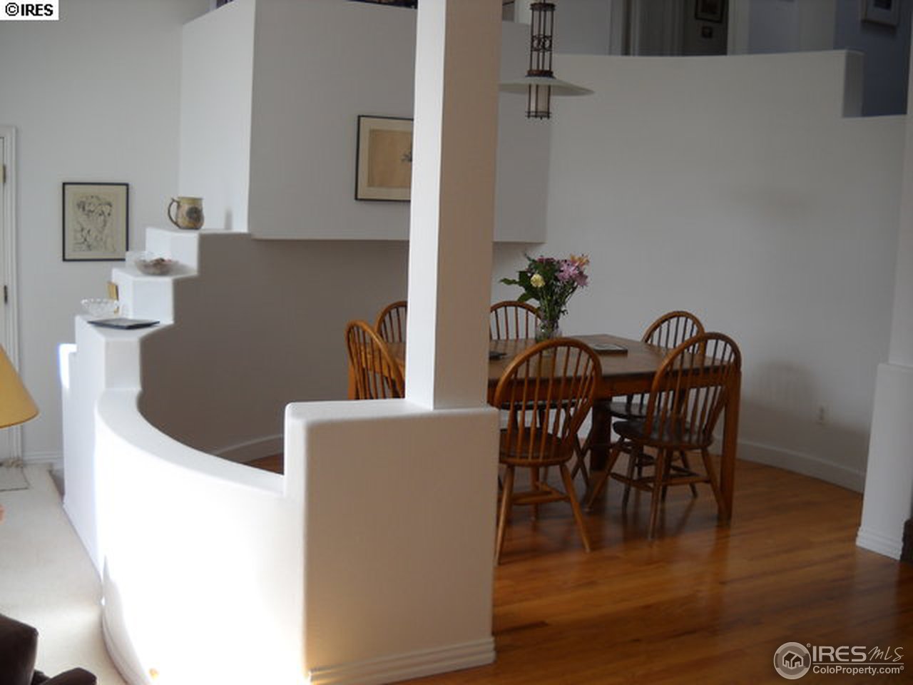 3172 Redstone Road Boulder, CO 80305 - Photo 8 of 24 a view of a dining room with furniture and wooden floor