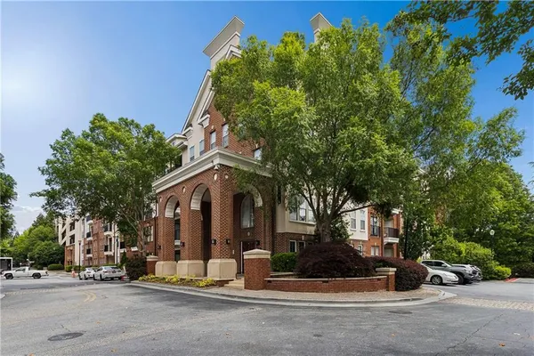 front view of a house with a tree