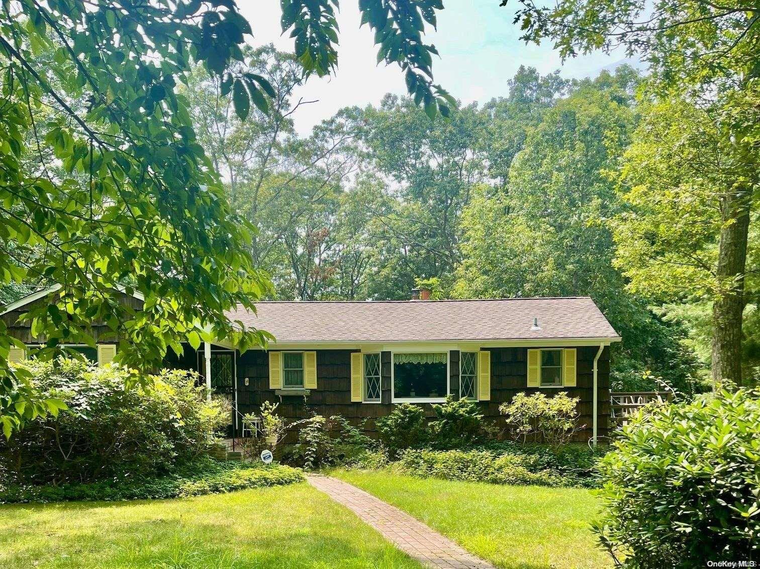 112 Woodlot Road Ridge, NY 11961 - Photo 1 of 1 a front view of a house with a yard