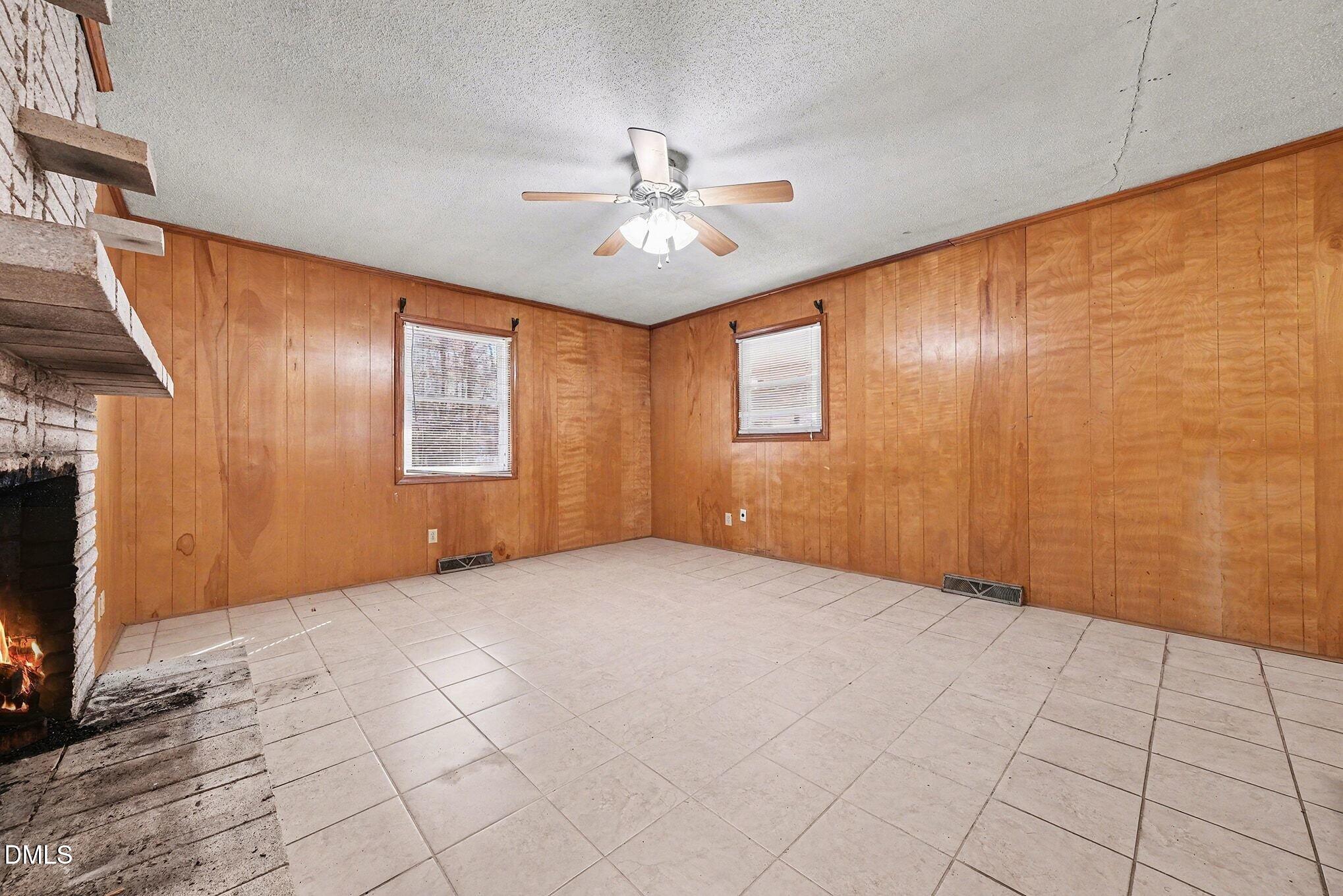 3312 Hamlin Road Durham, NC 27704 - Photo 9 of 37 a view of an empty room with a window