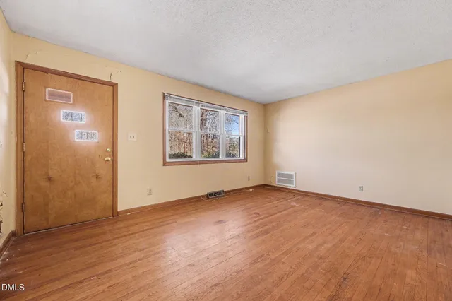 a kitchen with stainless steel appliances a refrigerator sink and cabinets
