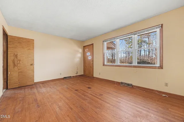 a room with a table and chairs