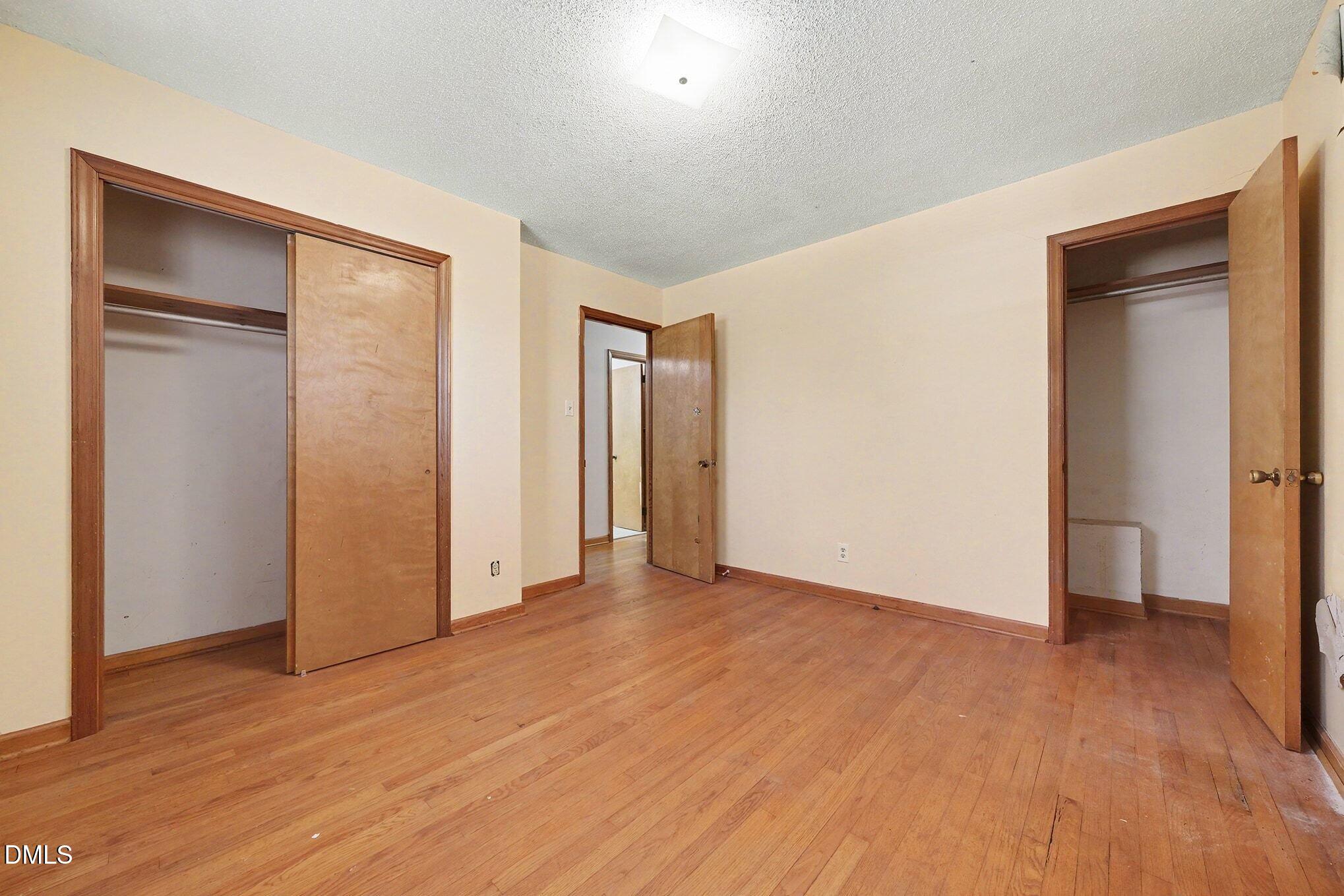 3312 Hamlin Road Durham, NC 27704 - Photo 18 of 37 a view of empty room with wooden floor