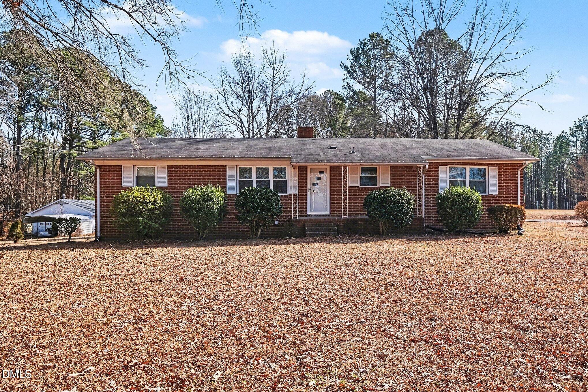 3312 Hamlin Road Durham, NC 27704 - Photo 2 of 37 a front view of a house with garden