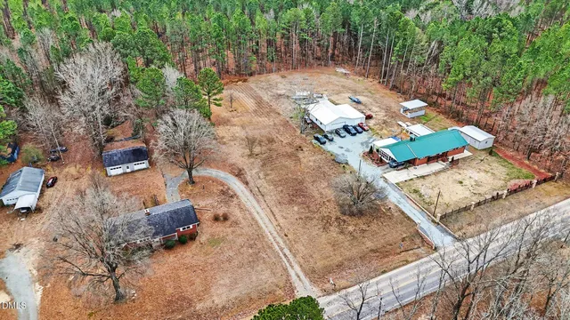 an aerial view of residential house with outdoor space