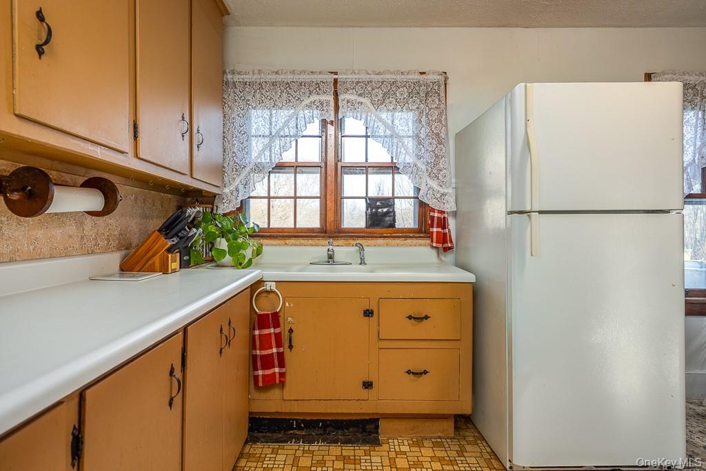 355 Fosler Road Wallkill, NY 12589 - Photo 14 of 33 Kitchen featuring freestanding refrigerator, light countertops, and light floors