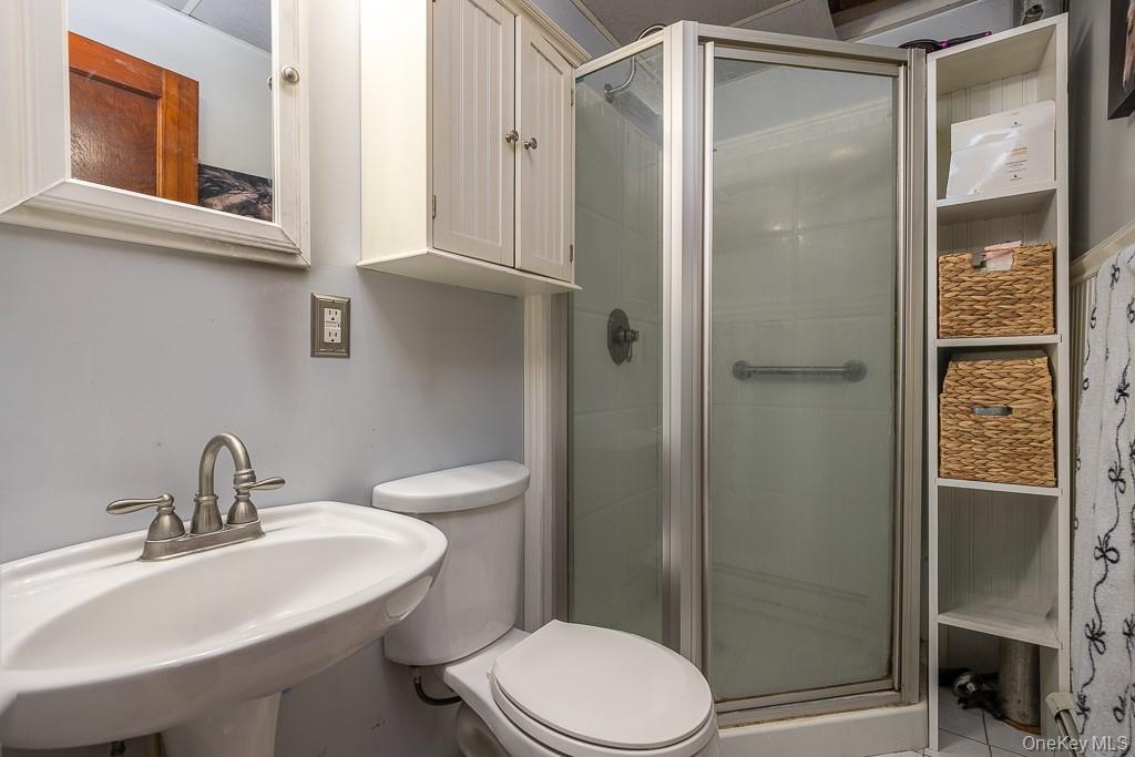 355 Fosler Road Wallkill, NY 12589 - Photo 20 of 33 Bathroom with a sink and a shower stall