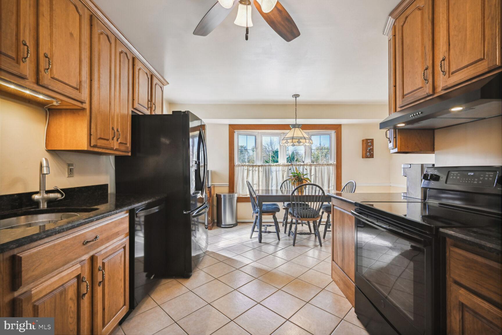 15317 Aylesbury Street Silver Spring, MD 20905 - Photo 13 of 57 Updated kitchen, looking into DR