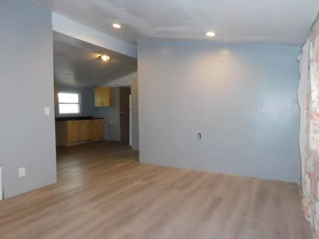 an empty room with a bathroom