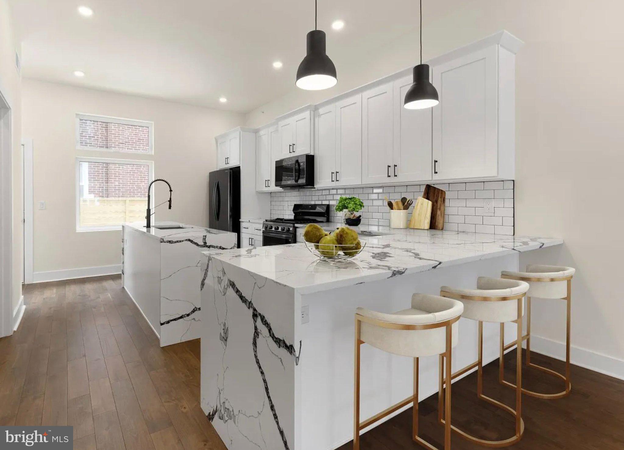 2719 Lefevre Street Philadelphia, PA 19137 - Photo 6 of 33 Sleek modern kitchen with marble accents.