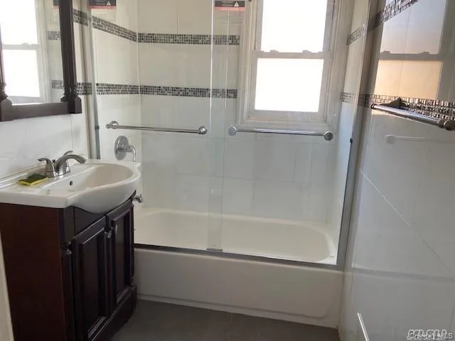 a bathroom with a sink and a bathtub