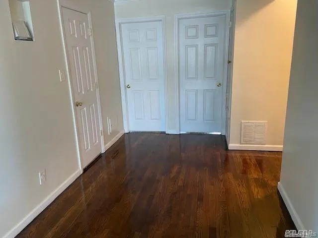 a view of a livingroom with wooden floor