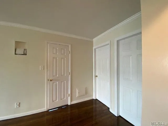 an empty room with wooden floor