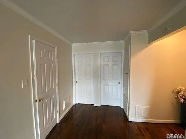 a view of a bedroom from a hallway