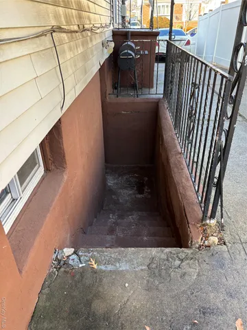 a view of a patio with a table and chairs