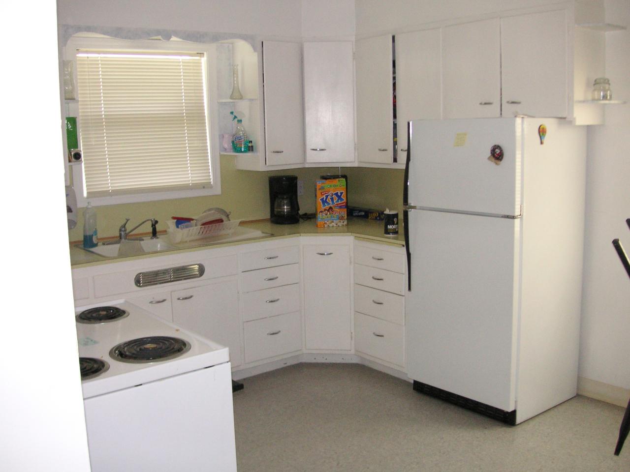 3100 Fort Road Toppenish, WA 98948 - Photo 3 of 7 a kitchen with white cabinets and white appliances