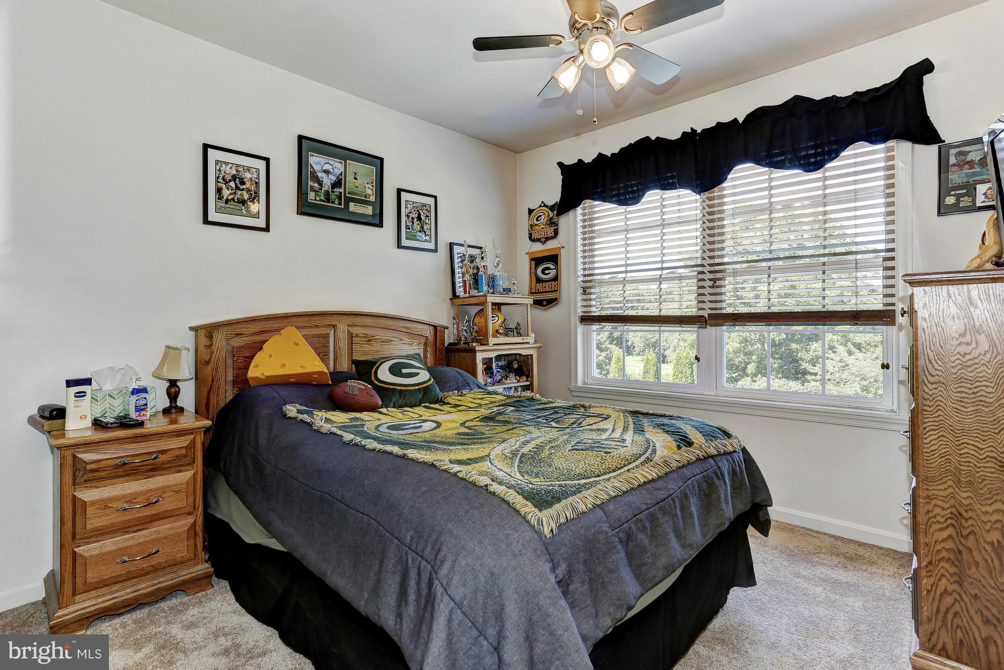 506 Ridge Road Finksburg, MD 21048 - Photo 16 of 30 a bedroom with a bed a dresser and window
