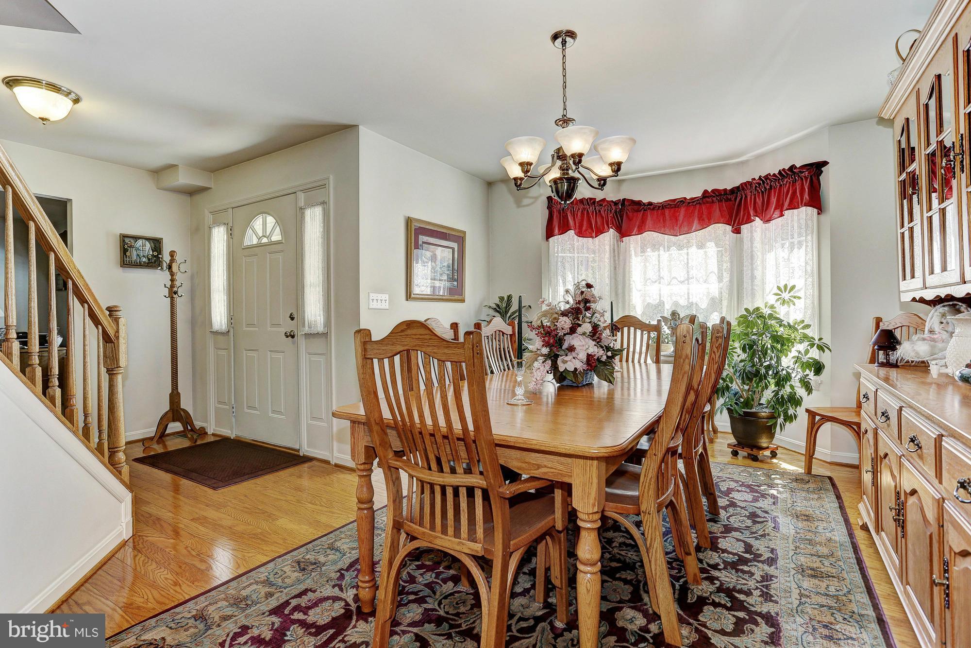 506 Ridge Road Finksburg, MD 21048 - Photo 3 of 30 a view of a dining room with furniture window and wooden floor