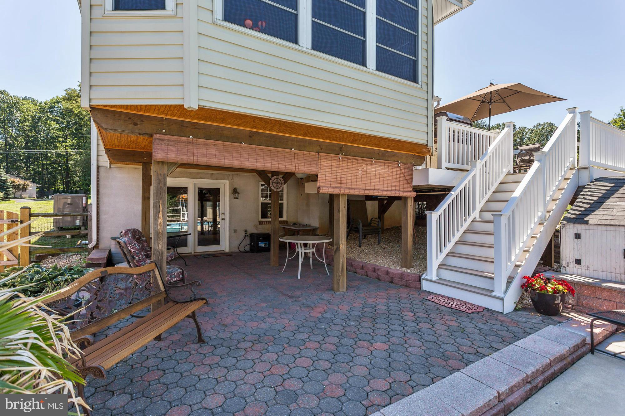 506 Ridge Road Finksburg, MD 21048 - Photo 23 of 30 a view of a patio with table and chairs with wooden floor and fence