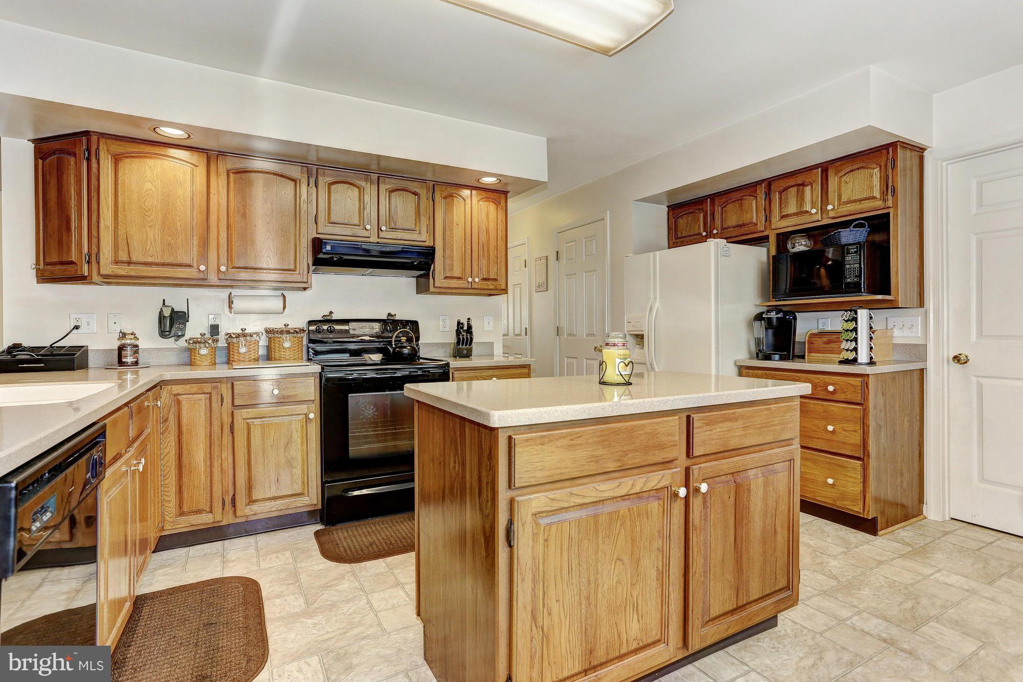 506 Ridge Road Finksburg, MD 21048 - Photo 6 of 30 a kitchen with cabinets appliances a sink and a window
