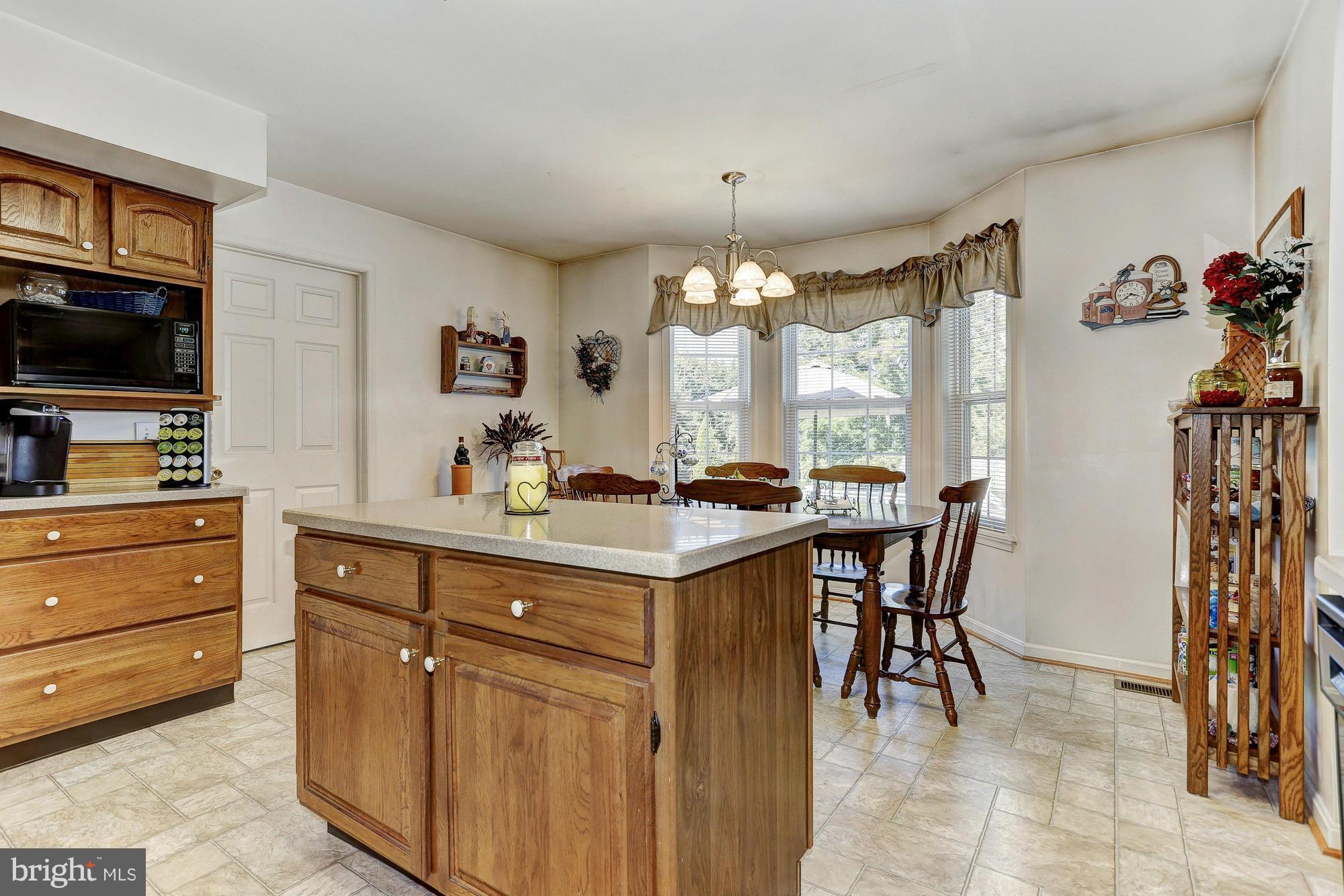 506 Ridge Road Finksburg, MD 21048 - Photo 7 of 30 a kitchen with a sink and cabinets