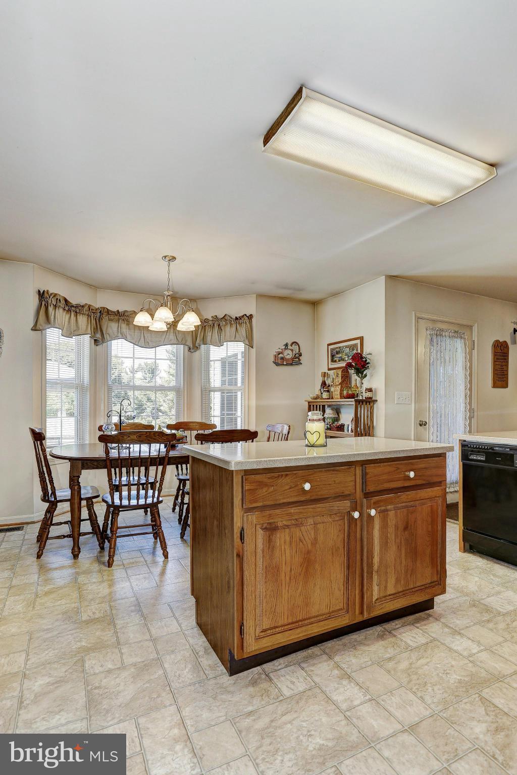 506 Ridge Road Finksburg, MD 21048 - Photo 8 of 30 a large kitchen with a table and chairs