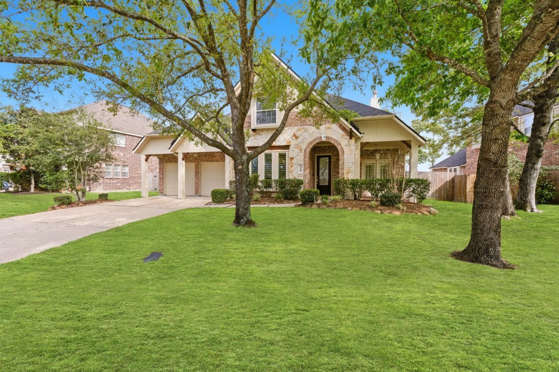 315 Arbor Ridge Lane Conroe, TX 77384 - Photo 1 of 47 A newly painted exterior and mature trees add to the curb appeal of this stunning home in The Arbors!
