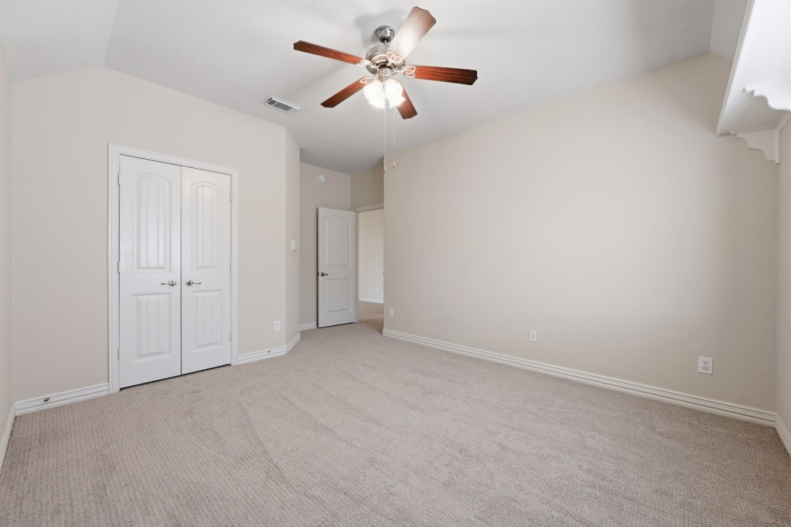 315 Arbor Ridge Lane Conroe, TX 77384 - Photo 29 of 47 Bedroom 2. All of the secondary bedrooms have substantial closets, making storage a breeze.