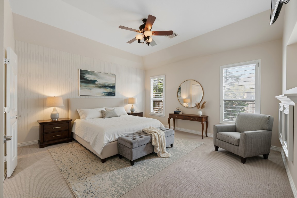 315 Arbor Ridge Lane Conroe, TX 77384 - Photo 7 of 47 The tranquil primary suite on the first floor features a tasteful accent wall, brand new carpet and custom built in storage.