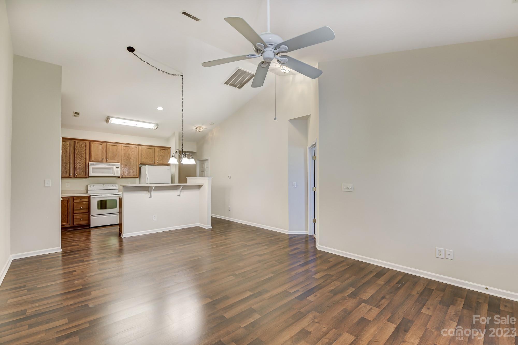3253 Sapphire Lane Fort Mill, SC 29708 - Photo 12 of 35 a view of a kitchen with wooden floor and a kitchen