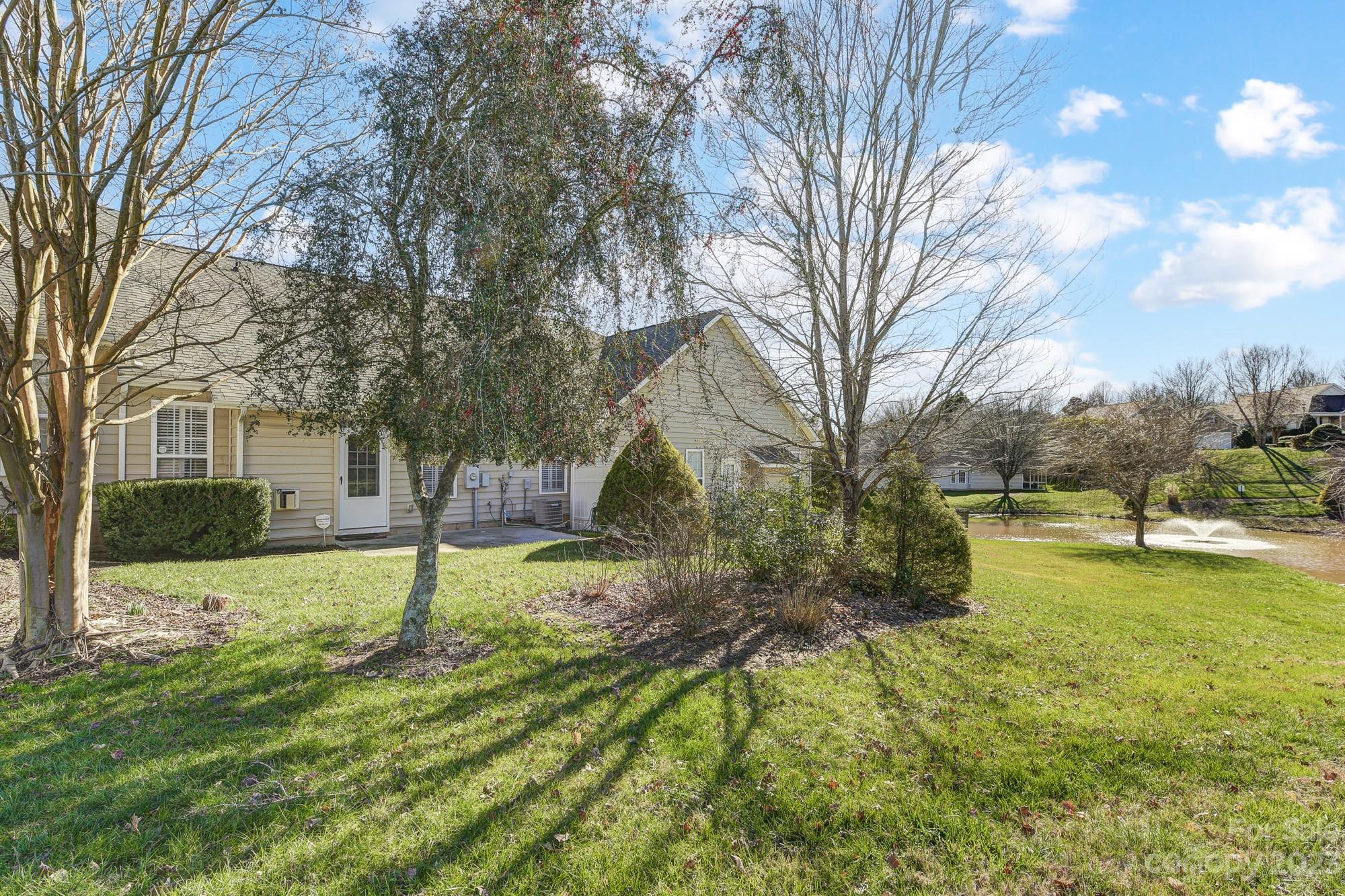 3253 Sapphire Lane Fort Mill, SC 29708 - Photo 2 of 35 a backyard of a house with swimming pool and basket ball court