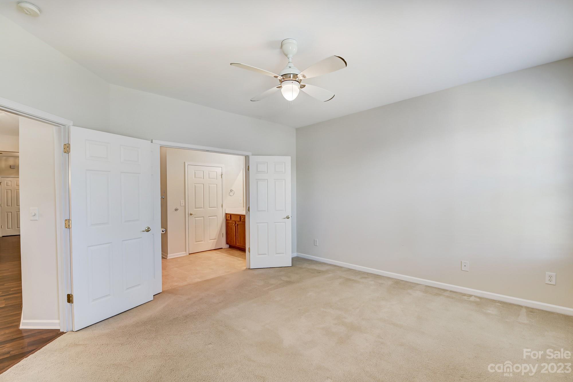 3253 Sapphire Lane Fort Mill, SC 29708 - Photo 21 of 35 a view of an empty room with a ceiling fan