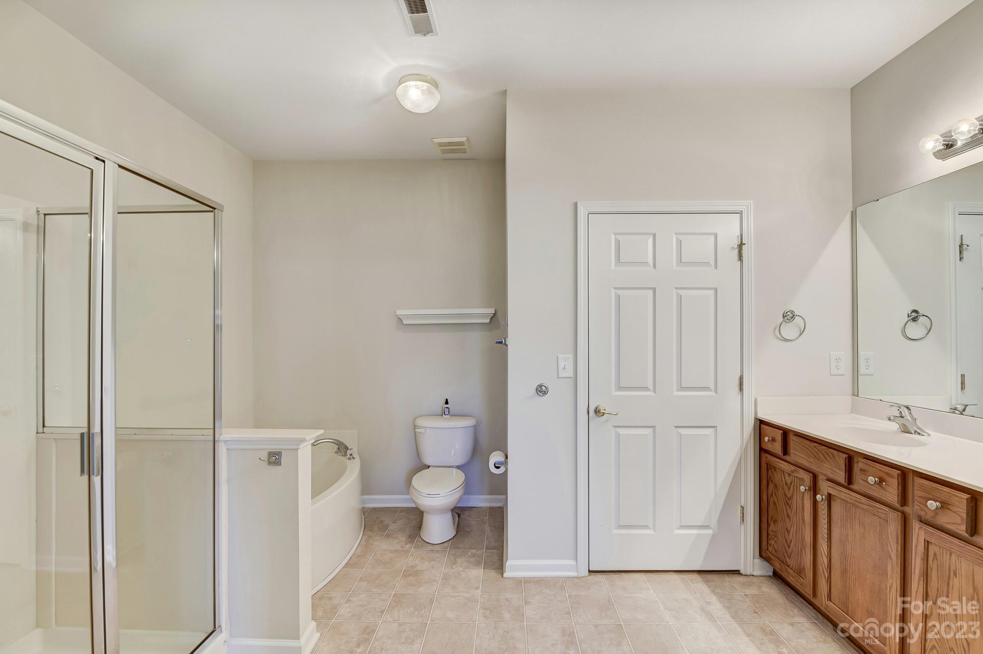 3253 Sapphire Lane Fort Mill, SC 29708 - Photo 24 of 35 a spacious bathroom with a double vanity sink a toilet and shower