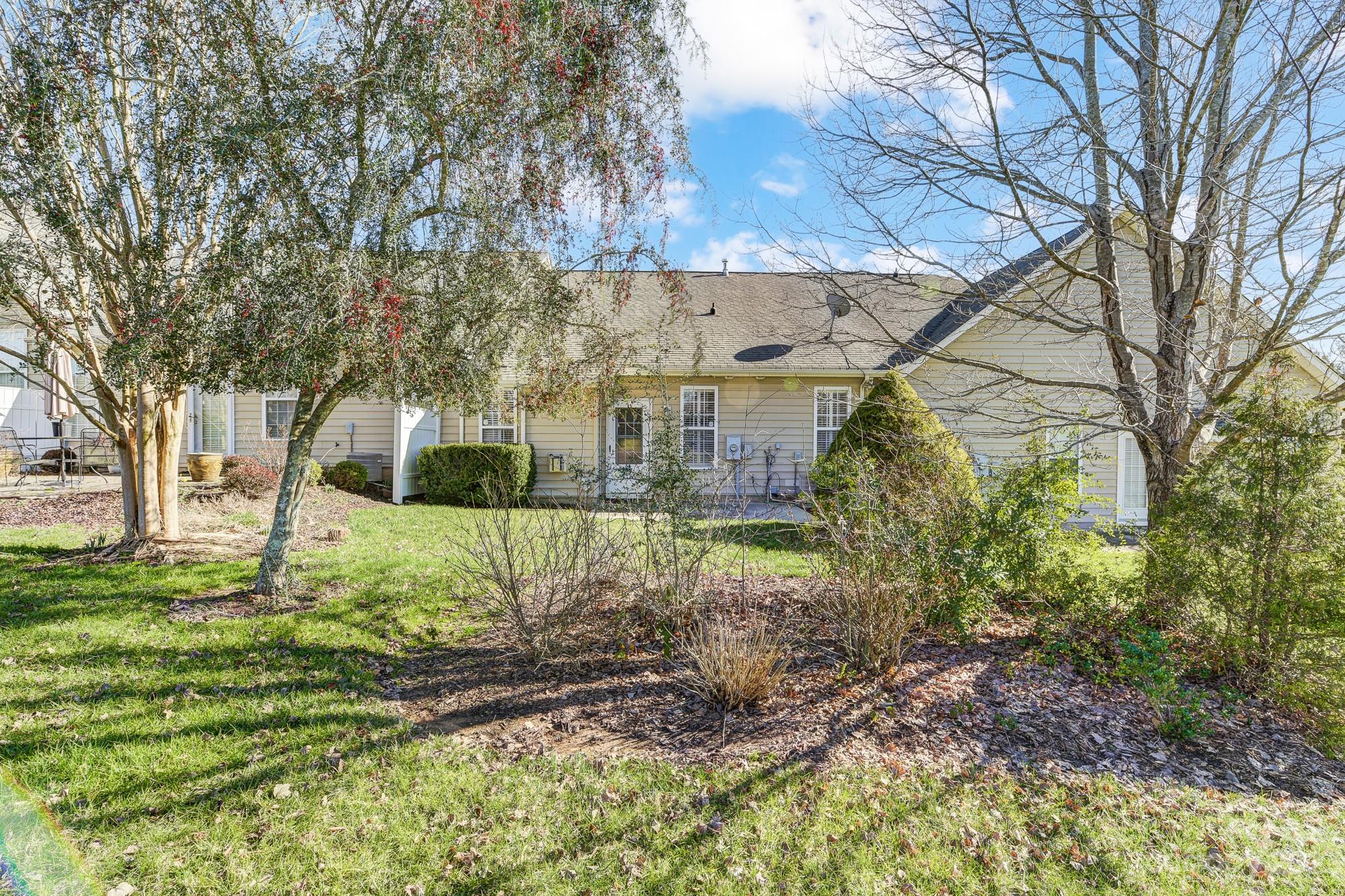 3253 Sapphire Lane Fort Mill, SC 29708 - Photo 35 of 35 a view of a yard with plants and a large tree