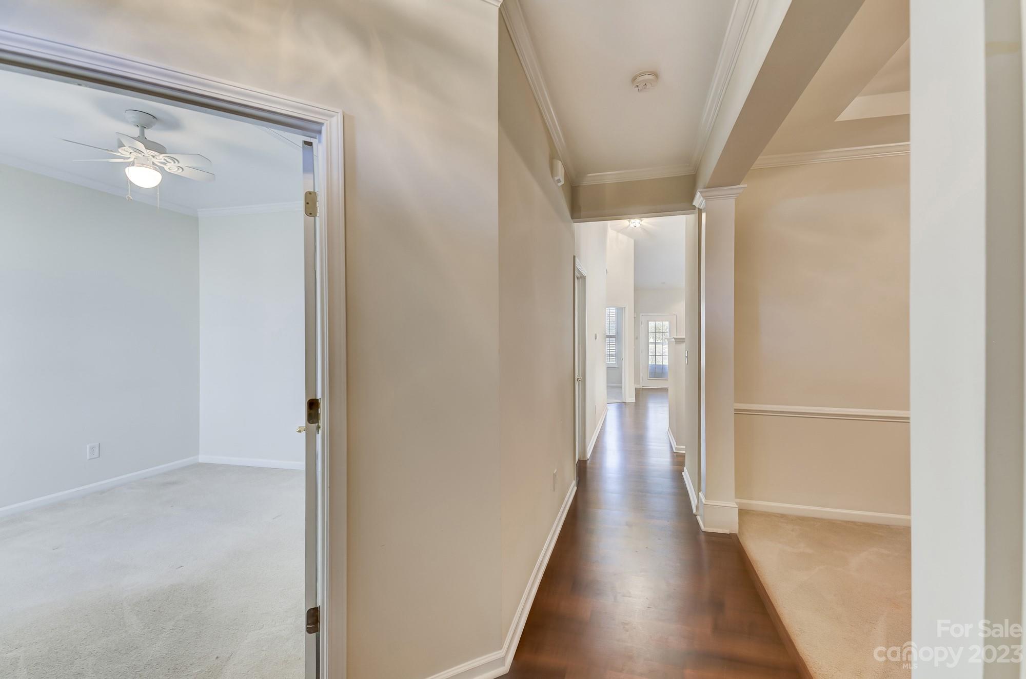 3253 Sapphire Lane Fort Mill, SC 29708 - Photo 4 of 35 a view of a hallway with wooden floor