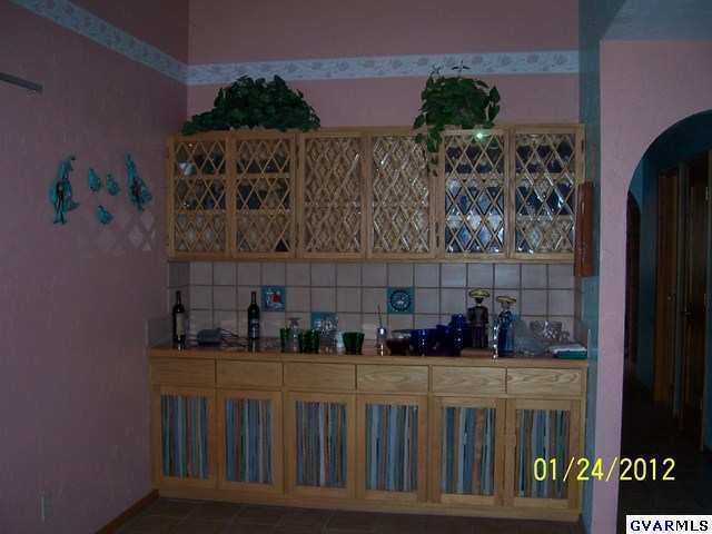 14765 West Jalisco Road Arivaca, AZ 85601 - Photo 7 of 24 a kitchen with a refrigerator and a sink